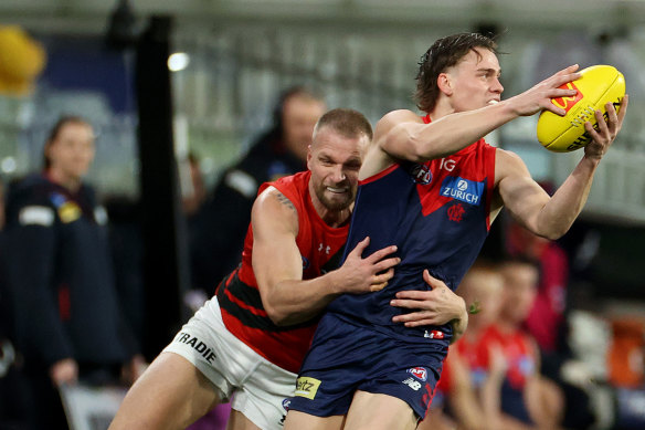 Star turn: Trent Rivers is tackled by Jake Stringer.