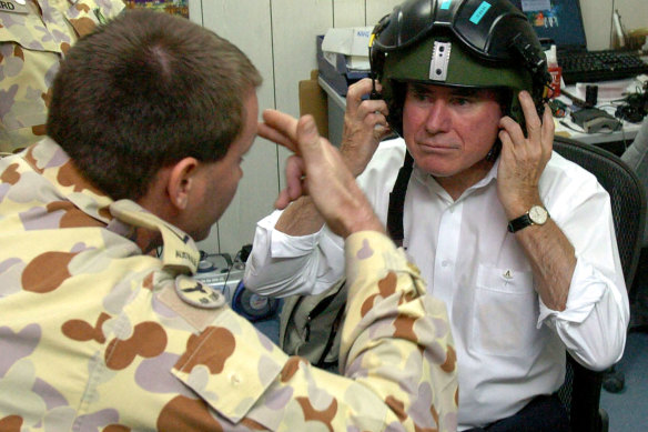 Former prime minister John Howard preparing to visit Australian troops in Iraq in 2004.