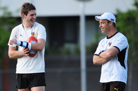 “Not a dog person.” Grant Birchall with Alastair Clarkson.