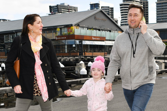Lisa DePaoli-Maber and Terry Rowland, pictured with Grace, had planned to marry on Central Pier, Docklands when they were forced into a last-minute change by the pier's closure. 