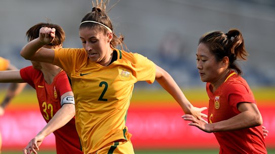 Comeback: Amy Harrison takes on China in her previous stint with the Matildas.