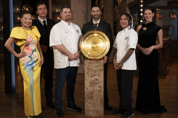 The MasterChef finalists and judge and their big shiny plate.