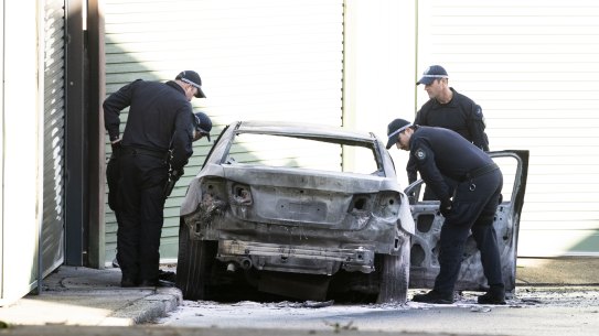 A burnt out car on Cook La, Zetland  is suspected to be linked to a fatal shooting in Bondi Junction early. June 27, 2023. Photo: Rhett Wyman / SMH