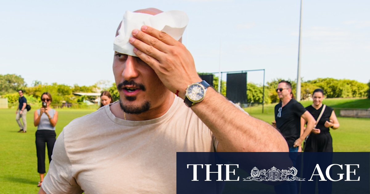 Peter Dutton kicks football into TV cameraman