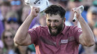 Jon Rahm, of Spain, celebrates on the 18th green after winning the Masters golf tournament at Augusta National Golf Club.