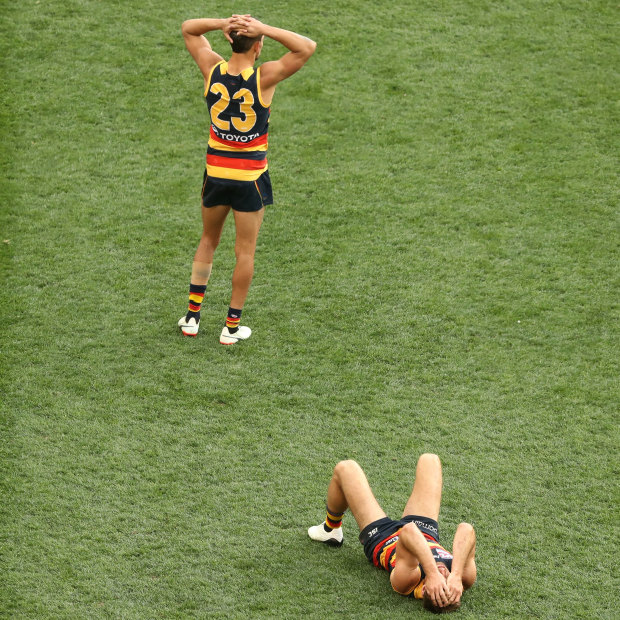 Dejected Adelaide Crows players after their defeat by the Richmond Tigers in the 2017 AFL Grand Final. 