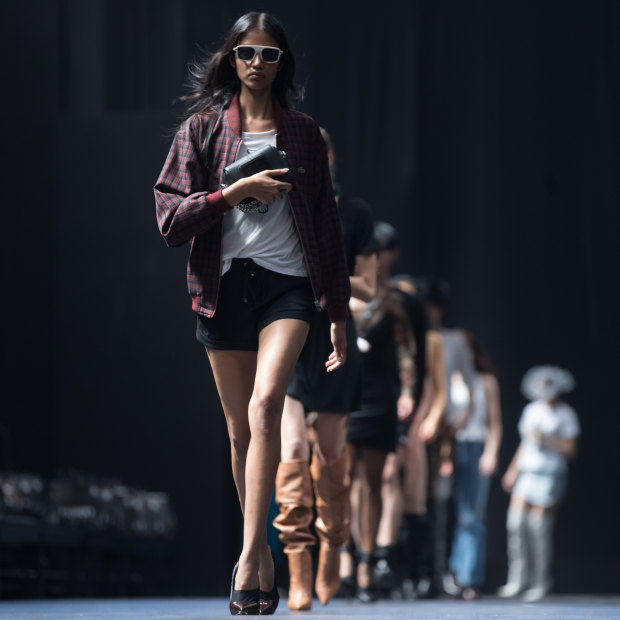 Models practise walking on the runway ahead of the Grand Showcase at VAMFF.