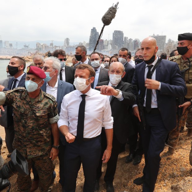 French President Emmanuel Macron inspects the site of the August 4 blast in Beirut.