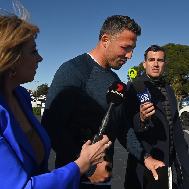 Souths legend Sam Burgess leaves club headquarters after a board meeting last August.