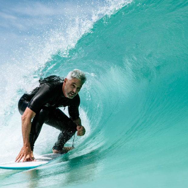 Urbnsurf founder Andrew Ross rides an artificial wave at his facility.