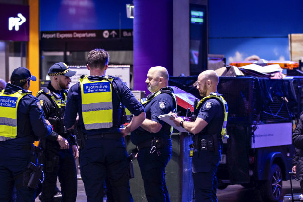 A woman looks on as police respond to an incident at Southern Cross Station on August 31.