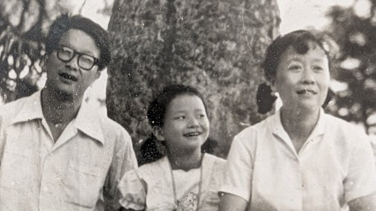Journalist Cheng Lei (centre, aged 9) with dad Chu-yong and mum Hua in Hunan province, China, 1984, right before Chu-yong came to Australia as a visiting scholar.