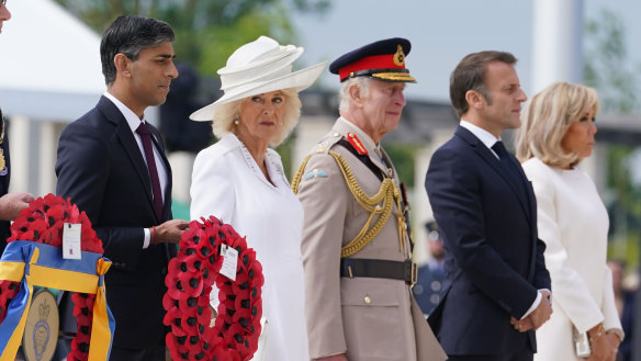British Prime Minister Rishi Sunak, Queen Camilla, King Charles, French President Emmanuel Macron and wife Brigitte Macron at the Normandy Memorial on Thursday. Sunak did not stay long.