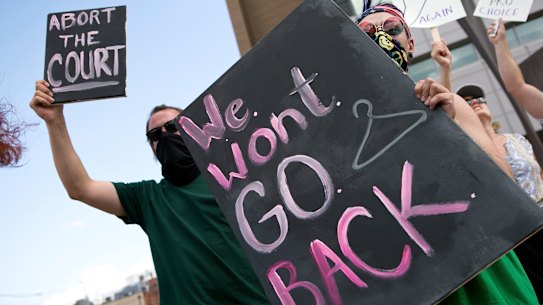 Charlie Wayne, left, Jasper Nieves and other demonstrators advocate for a woman’s right to an abortion in Roanoke, Virginia.