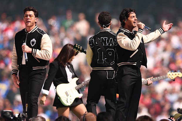 The Jonas Brothers perform at halftime of the NFL football game between the Los Angeles Rams and San Francisco 49ers at the Melbourne Cricket Ground on September 11, 2026 in Melbourne, Australia.