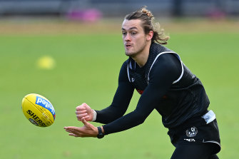 Collingwood defender Darcy Moore signed a new contract after the pay freeze.