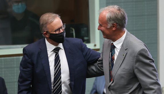 Opposition Leader Anthony Albanese congratulates Liberal MP John Alexander after he delivered his valedictory speech in the House of Representatives at Parliament House in Canberra.