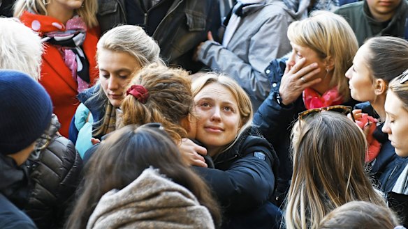Jack Merritt's girlfriend Leanne O'Brien is comforted at a vigil to remember the victims of the London Bridge attack.