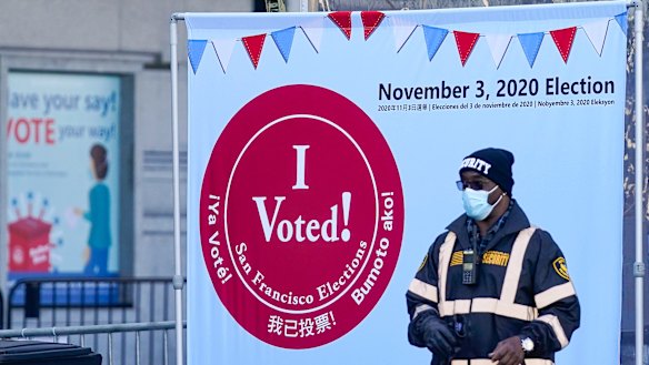 A security guard stands near an exit at a San Francisco Department of Elections voting centre near City Hall in San Francisco. 