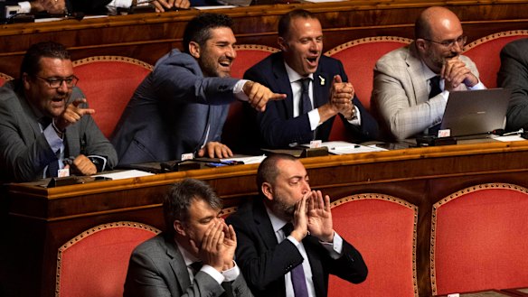 League senators supporting Interior Minister Matteo Salvini shout as Giuseppe Conte address the Senate.