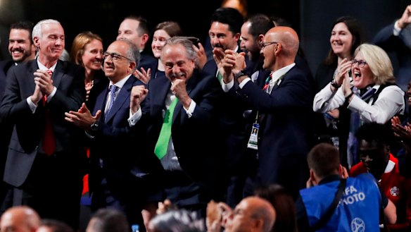 Delegates of Canada, Mexico and the United States celebrate after winning a joint bid to host the 2026 World Cup.