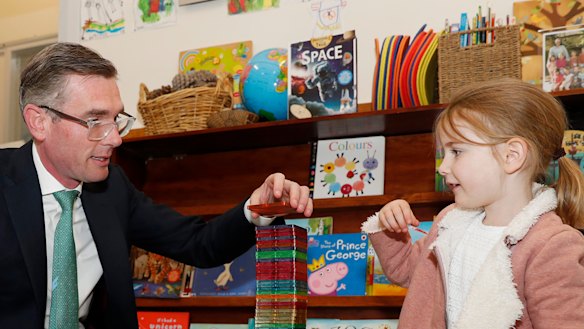 NSW Premier Dominic Perrottet plays with his daughter Harriet at preschool in 2022. 