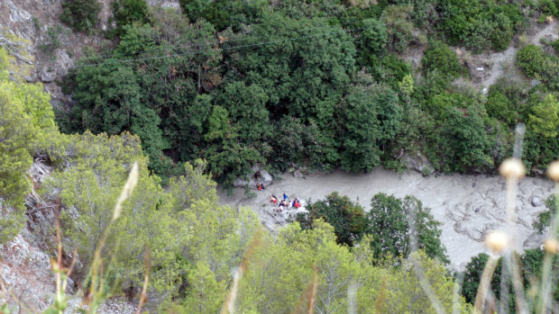 Rescuers work at the Raganello Gorge in Civita, Italy.