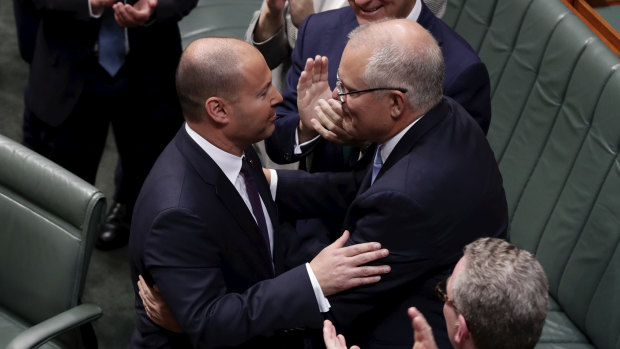Josh Frydenberg with Scott Morrison after the 2019-20 budget at which the Treasurer revealed plans to expand the government's long-term tax cut plan.