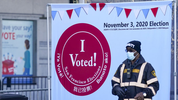 A security guard stands near an exit at a San Francisco Department of Elections voting centre near City Hall in San Francisco. 