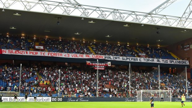 Respect: Genoa fans display a banner reading "In silence for you, hurt 43 times in the heart. Get back on your feet proudly and become splendid again!"
