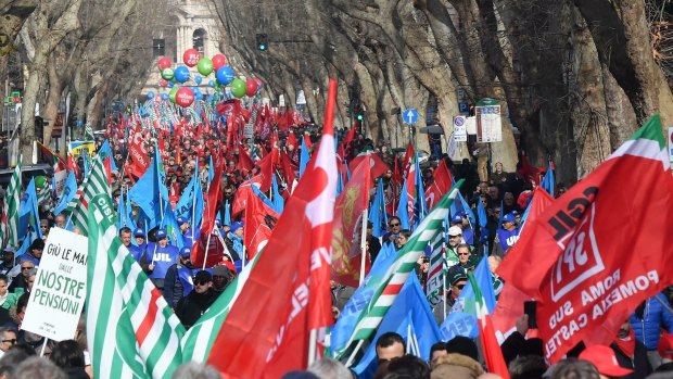 People march during the national trade union demonstration in Rome on Saturday.