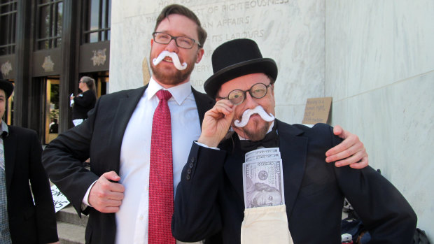 Poor People's Campaign activists protest tax cuts for the rich in Oregon on Monday. 