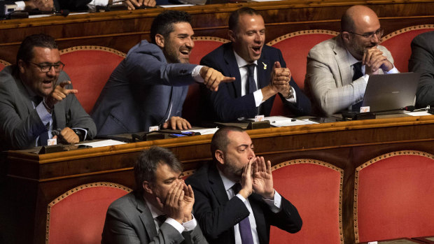 League senators supporting Interior Minister Matteo Salvini shout as Giuseppe Conte address the Senate.