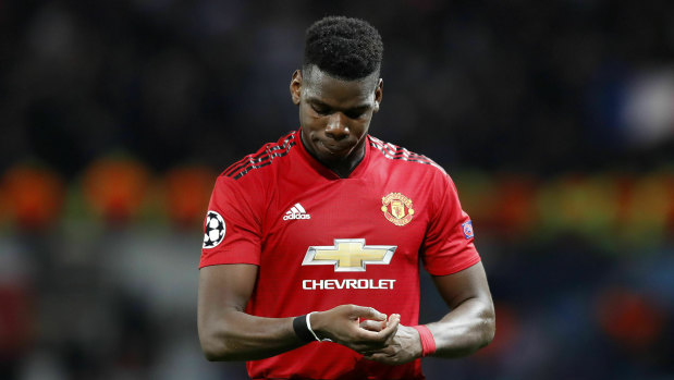 Red card: Manchester United's Paul Pogba leaves the field after being sent off to compound a disappointing night.