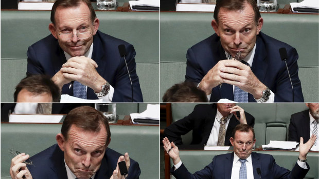 Tony Abbott reacts to Prime Minister Malcolm Turnbull talking in Parliament about energy policy.