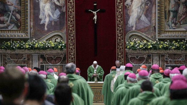 Pope Francis celebrates Mass at the Vatican on Sunday. The Pope has promised new laws that will ensure “no abuse should ever be covered up as was often the case in the past”.