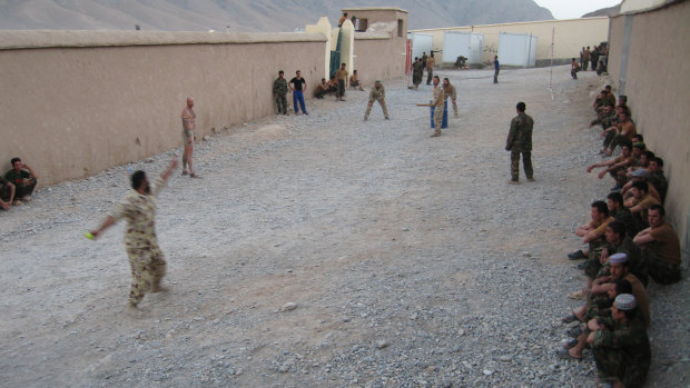 Australians and Afghans playing cricket in Chora Valley, Afghanistan, in 2008, with SAS sergeant Harry Moffitt taking strike.