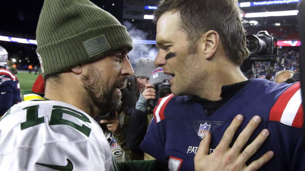 Brains trust: Superstar quaterbacks Aaron Rodgers and Tom Brady shake hands after the game.
