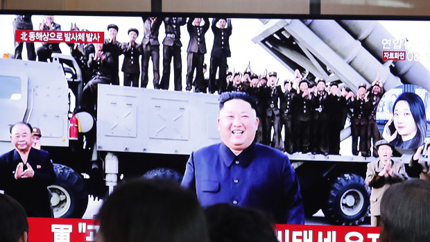 People watch a TV showing a file image of North Korean leader Kim Jong-un during a news program at the Seoul Railway Station in South Korea.