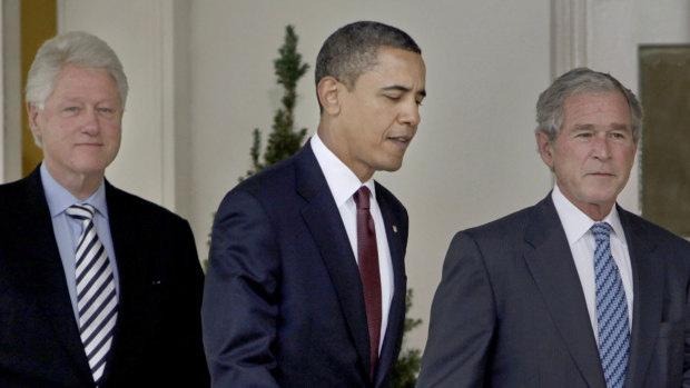 Attacked: Then-President Barack Obama, centre, walks out of the Oval Office of the White House with former presidents Bill Clinton, left, and George W. Bush in 2010.