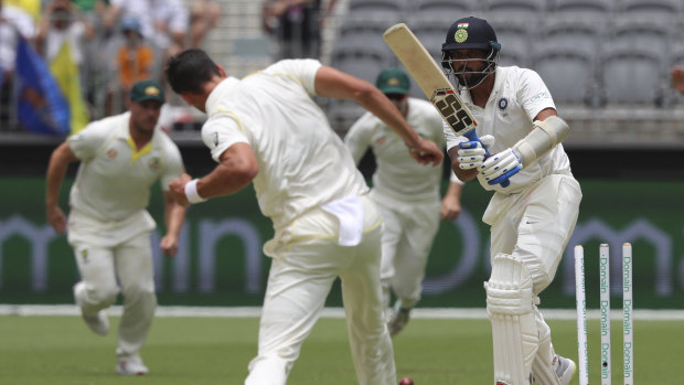 Bunny in headlights: Mitchell Starc bowls Murali Vijay with the last ball before lunch.