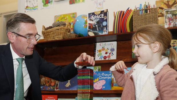 NSW Premier Dominic Perrottet plays with his daughter Harriet at preschool in 2022. 