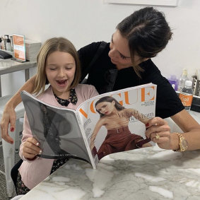 Victoria Beckham and daughter Harper enjoy some quality reading after manicures at a Sydney nail bar.