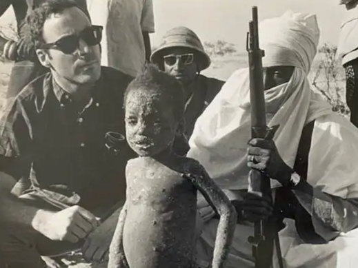 J. Michael Lane, shown at left in Niger in 1968, travelled around the world in the campaign to eradicate smallpox. 