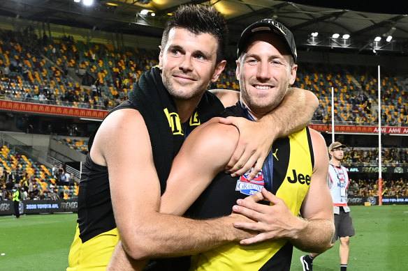 Trent Cotchin and Kane Lambert celebrate Richmond’s 2020 grand final win.