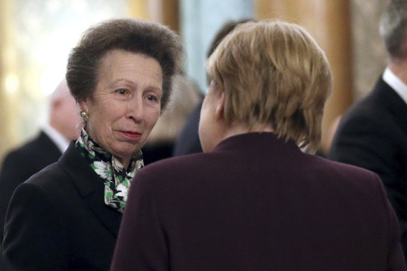 On the job ... Princess Anne talking with German Chancellor Angela Merkel.