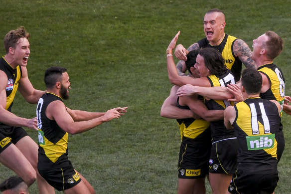 Tigers celebrate Marlion Pickett's goal on his AFL debut in the AFL grand final, which is a great story to top the club's brilliant comeback year.