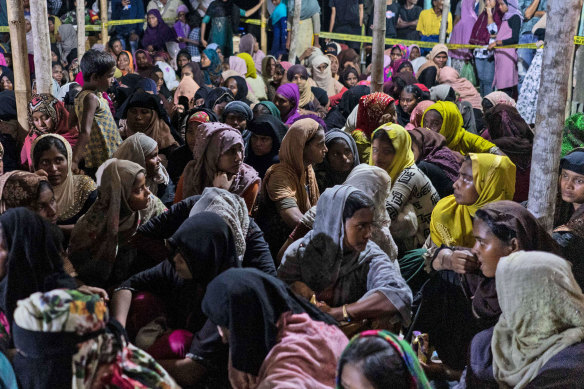 Ethnic Rohingya people rest after the boat carrying them landed in Lhokseumawe, Aceh province, Indonesia on Monday.