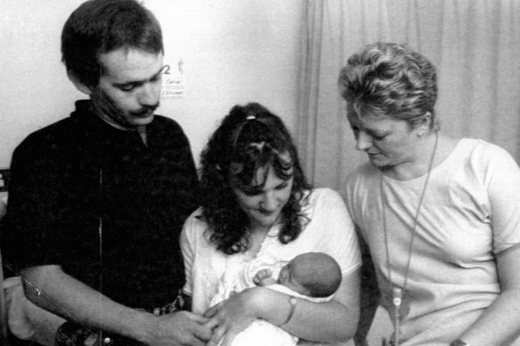 Colin Collier and Jennifer Collier with daughter Danielle Louise who was born on the lawn outside Newcastle hospital after the quake. On right is nursing unit manager Sister Julie Bridge who was present at the birth.
