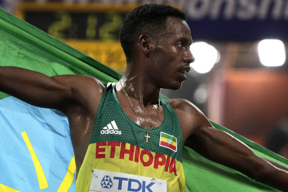 Lelisa Desisa of Ethiopia celebrates after winning the men's marathon at the World Athletics Championships in Qatar. 